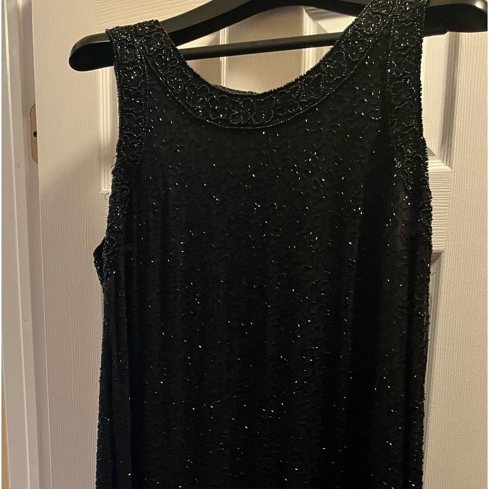 Beaded elegant woman's dress by Laurence Kazar
